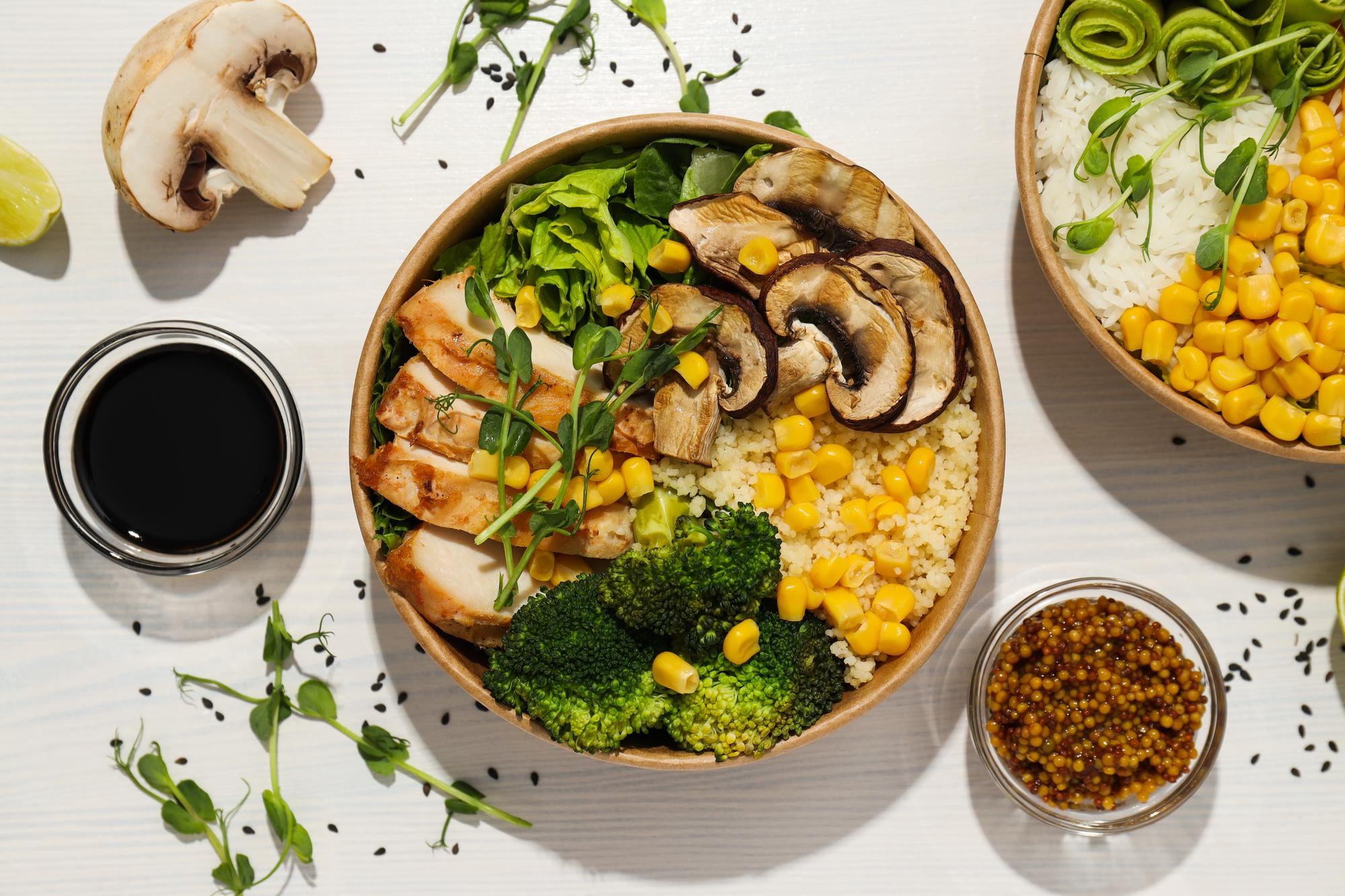 Colourful seasonal grain bowl with vegetables and herbs